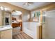 Bright bathroom with a separate tub and shower, conveniently located near the bedroom at 19815 E Progress Ln, Centennial, CO 80015