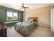 Cozy bedroom featuring a ceiling fan and a large window with neighborhood views at 19815 E Progress Ln, Centennial, CO 80015
