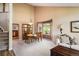 Elegant dining room bathed in natural light, adjacent to kitchen with view to staircase and sitting area at 19815 E Progress Ln, Centennial, CO 80015
