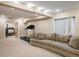 Cozy living room features comfortable seating, a treadmill and access to a bedroom at 19815 E Progress Ln, Centennial, CO 80015