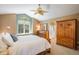 Serene main bedroom with a ceiling fan and an ensuite bathroom at 19815 E Progress Ln, Centennial, CO 80015