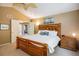 Spacious main bedroom featuring a large bed and an ensuite bathroom entrance at 19815 E Progress Ln, Centennial, CO 80015