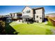 Backyard with a metal gazebo, artificial turf, a playground and a wood fence at 7150 E 121St Pl, Thornton, CO 80602