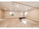Finished basement area with carpet, windows and fitness equipment to personalize your living experience at 7150 E 121St Pl, Thornton, CO 80602