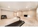Finished basement with carpeting, recessed lighting, and exercise equipment at 7150 E 121St Pl, Thornton, CO 80602