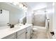 Bathroom featuring double sinks, updated fixtures, and shower over tub at 7150 E 121St Pl, Thornton, CO 80602