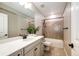 Bathroom featuring a vanity with quartz counters, tile flooring, and shower-tub combination at 7150 E 121St Pl, Thornton, CO 80602