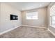 Serene bedroom features plush carpeting, neutral paint, a ceiling light, and bright windows at 7150 E 121St Pl, Thornton, CO 80602
