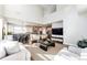 Open-concept living space with seamless flow between kitchen, dining, and living areas featuring modern design at 7150 E 121St Pl, Thornton, CO 80602