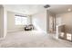 Carpeted loft area filled with natural light and a comfortable chair, perfect for relaxation or study at 7150 E 121St Pl, Thornton, CO 80602