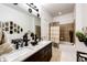 Bathroom with double vanity, granite countertop and bathtub at 9381 Ashbury Cir # 102, Parker, CO 80134