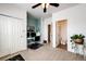 Bedroom with a ceiling fan, carpet, and an office area; the en-suite bath is attached at 9381 Ashbury Cir # 102, Parker, CO 80134