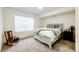 Bright bedroom with neutral paint, comfortable bedding, and natural light at 9381 Ashbury Cir # 102, Parker, CO 80134