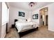 Bedroom with a large window, neutral walls, neutral carpet, and a comfortable bed at 9381 Ashbury Cir # 102, Parker, CO 80134
