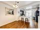 Dining area with hardwood floors and a view into the kitchen at 9381 Ashbury Cir # 102, Parker, CO 80134