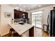 Bright kitchen with granite countertops, stainless steel appliances, and a sliding door to the outdoor patio at 9381 Ashbury Cir # 102, Parker, CO 80134