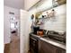 Well-organized laundry closet with stacked washer and dryer at 9381 Ashbury Cir # 102, Parker, CO 80134