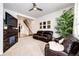 Spacious living room with a fireplace and leather furniture at 9381 Ashbury Cir # 102, Parker, CO 80134