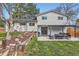 The backyard has a patio area with outdoor seating, creating an inviting space for relaxation at 6472 W Brittany Pl, Littleton, CO 80123