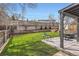 Large backyard with lawn, fence, patio and seating at 6472 W Brittany Pl, Littleton, CO 80123
