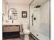 Modern bathroom with walk-in shower and sleek vanity at 6472 W Brittany Pl, Littleton, CO 80123