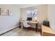 Bright office space featuring a window with a view and a modern desk setup at 6472 W Brittany Pl, Littleton, CO 80123
