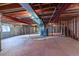 Spacious unfinished basement with exposed ceiling and supports, ready to be customized to your dream space at 870 Homestake Ct, Castle Rock, CO 80108