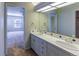 Bathroom featuring double sinks and view to the bedroom and bathroom at 870 Homestake Ct, Castle Rock, CO 80108