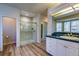 Well-lit bathroom with a glass-enclosed shower, a vanity, and modern fixtures at 870 Homestake Ct, Castle Rock, CO 80108