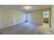 Bedroom featuring carpeted floors and windows with views of outside greenery at 870 Homestake Ct, Castle Rock, CO 80108