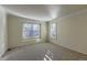 Bright bedroom with neutral carpet and plantation shutters at 870 Homestake Ct, Castle Rock, CO 80108