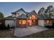 Brick and wood exterior featuring many windows and an inviting patio, perfect for outdoor enjoyment at 870 Homestake Ct, Castle Rock, CO 80108