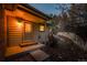 Charming front entrance with a cozy porch light, siding, and a well-maintained landscape at 870 Homestake Ct, Castle Rock, CO 80108
