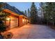 Attached two-car garage with brick exterior, offering ample parking and convenient access at 870 Homestake Ct, Castle Rock, CO 80108