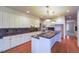 Well-appointed kitchen with white cabinetry, granite countertops, and stainless steel appliances at 870 Homestake Ct, Castle Rock, CO 80108