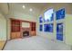 Open living room with vaulted ceilings, fireplace, built-ins and natural light at 870 Homestake Ct, Castle Rock, CO 80108