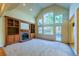 Bright living room with vaulted ceilings, fireplace, built-ins and large windows at 870 Homestake Ct, Castle Rock, CO 80108