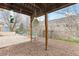Outdoor patio area with a wood trellis and fenced backyard at 217 Ford St, Golden, CO 80403