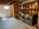 Basement laundry area with washer, dryer and shelving at 217 Ford St, Golden, CO 80403