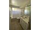 Cozy bathroom with a tiled floor, shower, and a white vanity at 217 Ford St, Golden, CO 80403