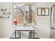 Cozy dining area showcasing natural light, modern seating, and charming decor at 217 Ford St, Golden, CO 80403