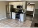 Well-lit kitchen featuring stainless steel appliances and white cabinetry at 217 Ford St, Golden, CO 80403