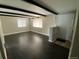 Spacious living room featuring hardwood floors, exposed beams, and bright windows at 217 Ford St, Golden, CO 80403