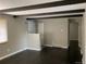 Bright living room showcasing hardwood floors, exposed beams, and a neutral color palette at 217 Ford St, Golden, CO 80403