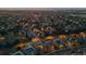 A beautiful neighborhood and homes, nestled among mature trees, all aglow in the late evening at 9368 S Silent Hills Dr, Lone Tree, CO 80124