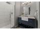 Modern bathroom featuring a glass-enclosed shower and a stylish vanity with ample storage at 9368 S Silent Hills Dr, Lone Tree, CO 80124