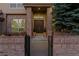 Inviting home entrance featuring a brick facade and well-maintained landscaping at 9368 S Silent Hills Dr, Lone Tree, CO 80124