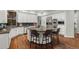 Gourmet kitchen features a large island, stainless steel appliances, and custom cabinetry at 9368 S Silent Hills Dr, Lone Tree, CO 80124
