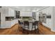 Gourmet kitchen features a large island, stainless steel appliances, and custom cabinetry at 9368 S Silent Hills Dr, Lone Tree, CO 80124