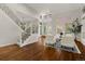 Bright and airy living room with hardwood floors and large windows at 9368 S Silent Hills Dr, Lone Tree, CO 80124